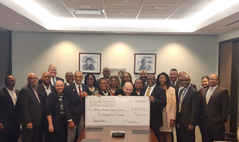 Check presentation to the African American Community Alliance